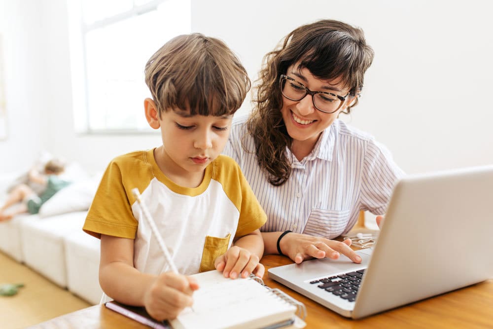 About OHDELA. Mom and son doing homework.