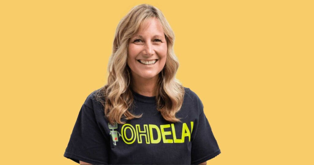 Teacher wearing a OHDELA shirt